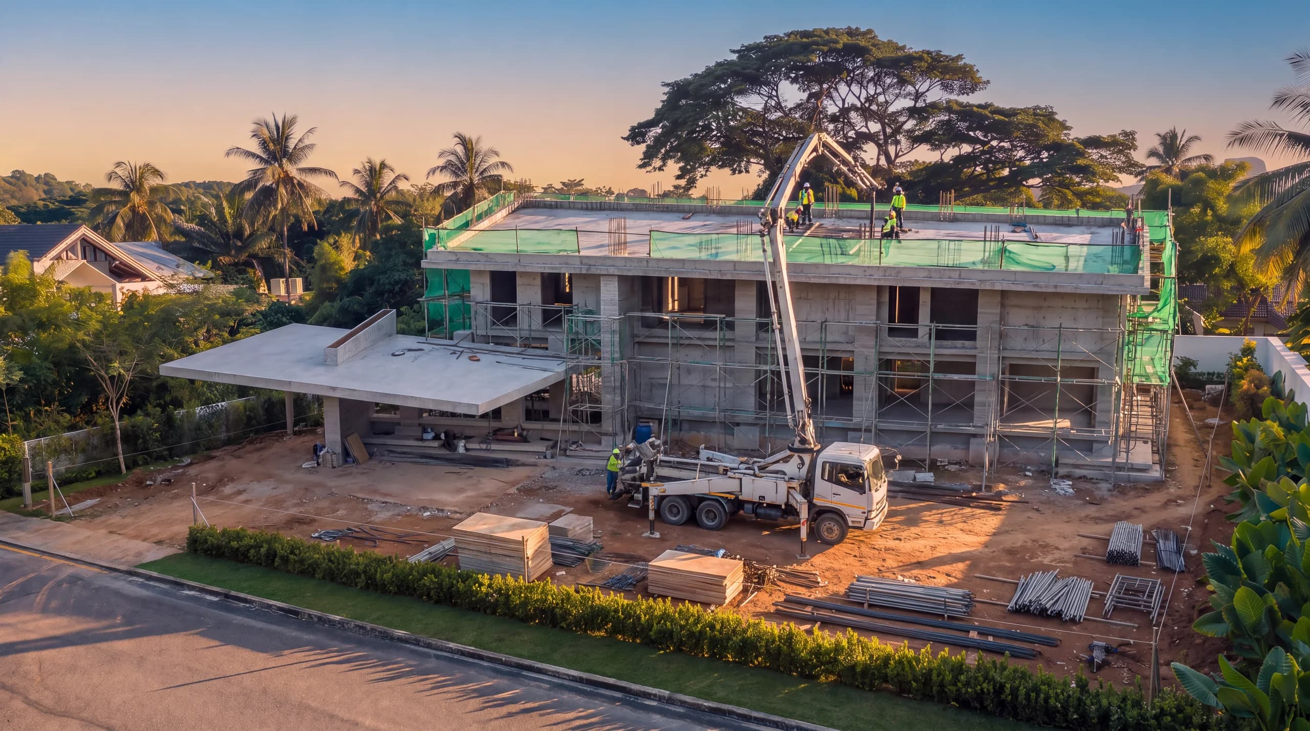 The frame topped out on the plot, with a concrete pump over the roof slab and scaffold around the structure